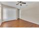 Bedroom with hardwood floors, double door closet and ceiling fan at 1101 Swanson Dr, Deltona, FL 32738