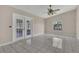 Gathering room with tile floors and sliding glass doors to backyard at 1101 Swanson Dr, Deltona, FL 32738