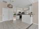 Eat-in kitchen with white cabinets and granite countertops at 1101 Swanson Dr, Deltona, FL 32738