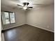 Spacious bedroom with wood-look flooring and window at 1461 Lancelot, Casselberry, FL 32707