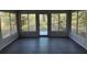 Bright sunroom with dark flooring and backyard access at 1461 Lancelot, Casselberry, FL 32707