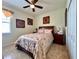 Bedroom with a full bed, wooden furniture, and ceiling fan at 1506 Bunker Dr, Davenport, FL 33896