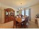 Formal dining room with wood table and hutch at 1506 Bunker Dr, Davenport, FL 33896