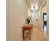 Bright and airy entryway with tile flooring and console table at 1506 Bunker Dr, Davenport, FL 33896