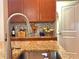 Modern kitchen sink and faucet with granite countertop at 1506 Bunker Dr, Davenport, FL 33896