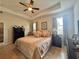 King-size bed, ceiling fan, and ample closet space in the main bedroom at 1506 Bunker Dr, Davenport, FL 33896