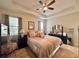 Large main bedroom with a king-size bed and ceiling fan at 1506 Bunker Dr, Davenport, FL 33896