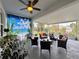 Relaxing screened porch with seating area and tropical decor at 1506 Bunker Dr, Davenport, FL 33896