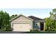 One-story home with a two-car garage and attractive landscaping at 1593 Bull Hill Rd, Kissimmee, FL 34744