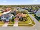 Stunning aerial view of a beautiful home in a residential area, featuring a well-manicured lawn and landscaping at 15937 Birchwood Way, Orlando, FL 32828