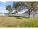 Expansive backyard with lush green grass and a privacy fence at 15937 Birchwood Way, Orlando, FL 32828