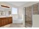 Bright bathroom with glass shower, garden tub, and double sink vanity at 15937 Birchwood Way, Orlando, FL 32828