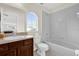 Charming bathroom featuring a vanity, a large window, and a shower-tub combination at 15937 Birchwood Way, Orlando, FL 32828