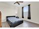 Cozy bedroom features wood-look flooring and a modern ceiling fan at 15937 Birchwood Way, Orlando, FL 32828