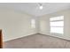 A roomy bedroom with carpet, natural light, and neutral walls at 15937 Birchwood Way, Orlando, FL 32828