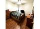 Bedroom with wood flooring, ceiling fan, and ample closet space at 1701 Sparkling Water Cir, Ocoee, FL 34761