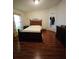 Bright bedroom with dark wood furniture and laminate flooring at 212 Ashford Dr, Davenport, FL 33837