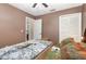 Bedroom with access to bathroom and closet at 2210 Kentucky Derby Dr, Orlando, FL 32825