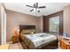 Bedroom with window seat and ceiling fan at 2210 Kentucky Derby Dr, Orlando, FL 32825