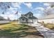 Two-story house with a green exterior, attached garage, and a well-maintained lawn at 2210 Kentucky Derby Dr, Orlando, FL 32825