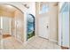 Spacious entryway with a calming nature mural and tile flooring at 2249 Wyndham Palms Way, Kissimmee, FL 34747