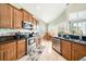 Spacious kitchen with stainless steel appliances and granite countertops at 2249 Wyndham Palms Way, Kissimmee, FL 34747