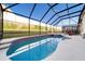 Enclosed pool and spa with a covered patio at 2249 Wyndham Palms Way, Kissimmee, FL 34747