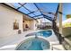 Relaxing pool and spa area with screened enclosure at 2249 Wyndham Palms Way, Kissimmee, FL 34747