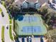 Two tennis courts with parking and landscaping at 2249 Wyndham Palms Way, Kissimmee, FL 34747