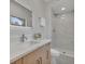 Bathroom with walk-in shower and modern vanity at 2421 Healy Dr, Orlando, FL 32818