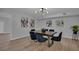 Dining area with dark wood table and six black velvet chairs at 2421 Healy Dr, Orlando, FL 32818