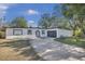 Updated single story home with modern exterior and driveway at 2421 Healy Dr, Orlando, FL 32818