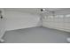 Large garage with open overhead door and grey floor at 2421 Healy Dr, Orlando, FL 32818