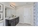 Double vanity bathroom with dark cabinets and a shower/tub combo at 2440 Belle Haven Way, Davenport, FL 33896