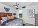 Modern bedroom with geometric bedding and inspirational wall art at 2440 Belle Haven Way, Davenport, FL 33896