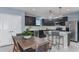 Kitchen with dark cabinets, white quartz countertops, and stainless steel appliances at 2440 Belle Haven Way, Davenport, FL 33896