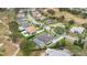 Aerial view of a luxury house and neighborhood at 25500 Hawks Run Ln, Sorrento, FL 32776