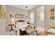 Elegant bedroom with antique bed, plenty of natural light, and an en-suite bathroom at 25500 Hawks Run Ln, Sorrento, FL 32776