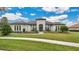 Luxury home with stone accents and a tile roof at 25500 Hawks Run Ln, Sorrento, FL 32776