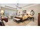 Main bedroom with king-size bed and seating area at 25500 Hawks Run Ln, Sorrento, FL 32776