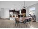 Open concept dining area with a live edge table and modern chandelier at 2662 Tahoe Ter, St Cloud, FL 34771