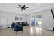 Bright living room featuring a sectional sofa and sliding glass doors at 2662 Tahoe Ter, St Cloud, FL 34771