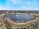 Aerial view of community lake with walking paths and fountain at 268 Heatherbrooke Cir, Oviedo, FL 32765