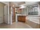 Bathroom with walk-in shower, soaking tub, and modern wood cabinets at 268 Heatherbrooke Cir, Oviedo, FL 32765