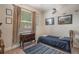 Cozy guest bedroom featuring a twin bed, dresser and aviation-themed decor at 268 Heatherbrooke Cir, Oviedo, FL 32765