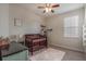 Bedroom featuring a crib, dresser, and window at 268 Heatherbrooke Cir, Oviedo, FL 32765