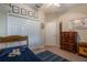 Well-lit guest bedroom with a twin bed, dresser and world map decor at 268 Heatherbrooke Cir, Oviedo, FL 32765