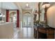 Bright and spacious entryway with tile flooring and a decorative console table at 268 Heatherbrooke Cir, Oviedo, FL 32765