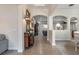 Elegant hallway with tile floors, arched doorways, and soft lighting at 268 Heatherbrooke Cir, Oviedo, FL 32765