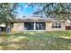 Back of house showing screened porch and yard at 268 Heatherbrooke Cir, Oviedo, FL 32765